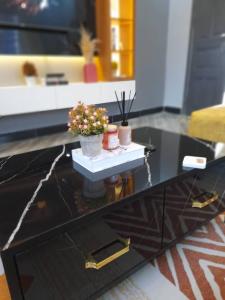 a model of a living room with a coffee table at Serene Homes 04 in Kampala