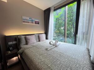 Voodi või voodid majutusasutuse 市中心URBITIA 精品公寓 toas