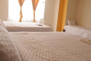 Ένα ή περισσότερα κρεβάτια σε δωμάτιο στο Gran Hotel
