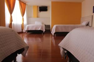 Un pat sau paturi într-o cameră la Gran Hotel