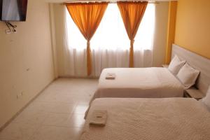 Gran Hotel tesisinde bir odada yatak veya yataklar
