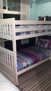 a couple of bunk beds in a room at Ocean View 2 BR Condo in Tijuana
