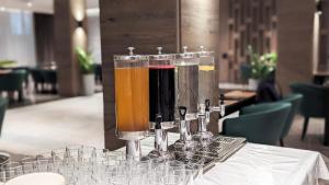 a group of three drinks sitting on a table at Raavah Aparthotel in Almaty