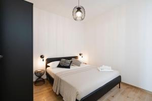 Postel nebo postele na pokoji v ubytování Le CORALLINE APARTMENTS