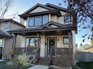 a house with a front door and a porch at Spacious & Private Retreat near West Edmonton Mall in Edmonton