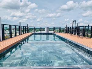 a swimming pool on the roof of a building at Linh Phuong 6 Hotel in Can Tho