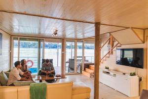a group of people sitting in a living room at Splav Nala in Belgrade