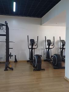 a gym with several exercise bikes in a room at Urban Oasis Apartment by Edmor Suites in Nairobi