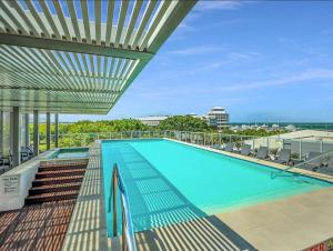 a swimming pool on the roof of a building at 219 Harbour Lights with Ocean Views in Cairns