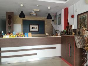 a kitchen with a counter in a room at M Three Hotel by SECOMS in Kampong Batu Tiga