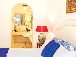 A bed or beds in a room at Caramel, A Grecotel Resort to Live