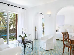 A bed or beds in a room at Caramel, A Grecotel Resort to Live