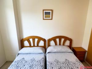 Postel nebo postele na pokoji v ubytování El Paraíso en Playa Concha