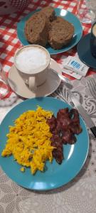 a table with three plates of eggs and bread at La dimora dei musicisti in Castelfidardo
