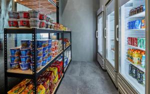 a grocery store aisle with shelves filled with food at Hotel Riverside Ulsan in Ulsan +19 photos