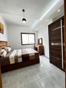 Katil atau katil-katil dalam bilik di Appartement neuf Ahlan 2 chambres