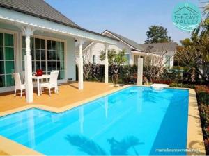 a swimming pool in front of a house at The Cave Valley เดอะเคฟว วัลเลย์ in Ban Chong (2)