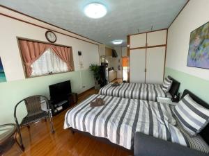 Postelja oz. postelje v sobi nastanitve NAGO Sakura Resort Inn - Vacation STAY 14448v