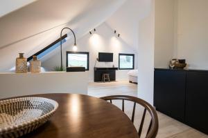 TV a/nebo společenská místnost v ubytování B&B Amelhof