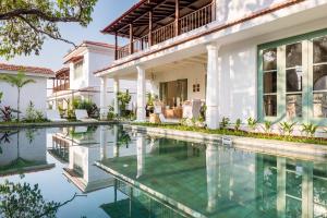an image of a house with a swimming pool at La Mosteiro by The Blue Kite - in Assagao, Splendid 3&4BHK Villas with Private Pool, Private Parking, Garden, Caretaker, Kitchen & Security in Vagator