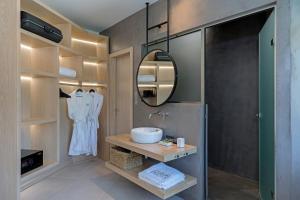 a bathroom with a sink and a mirror at Super Luxury Skiathos Villa Five-Bedroom Villa Private Infinity Pool & Astounding Sea Views Skiathos Town in Skiathos Town +31 photos