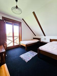 Posteľ alebo postele v izbe v ubytovaní Gościniec Gryszczeniówka & SPA