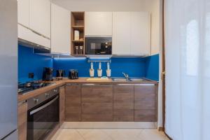 Kuchyň nebo kuchyňský kout v ubytování Nordic Style - 5 min dall'Arena & Parcheggio