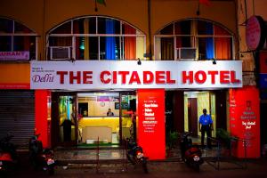 a hotel with motorcycles parked in front of it at HOTEL CITADEL in Vasco Da Gama