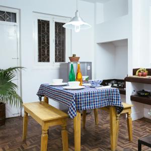 a kitchen with a table with a blue and white table cloth at The Global Nomad Apt Centrally Located in Kathmandu