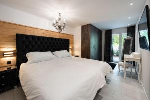 Postel nebo postele na pokoji v ubytování Melchtal Resort Apart Hotel