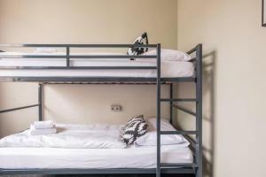 Cama ou camas em um quarto em WALLYARD Stay
