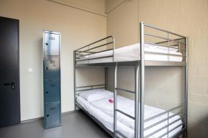 Cama ou camas em um quarto em WALLYARD Stay