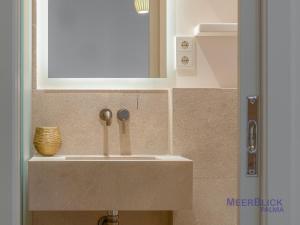 a sink in a bathroom with a mirror at Aparttime Palma mit MeerBlick Dach-Terrassen in Palma de Mallorca
