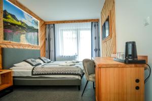Posteľ alebo postele v izbe v ubytovaní My Tatra Residence