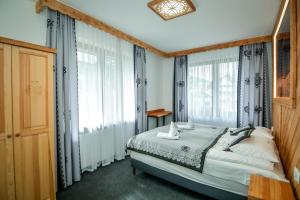 Posteľ alebo postele v izbe v ubytovaní My Tatra Residence