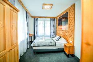 Posteľ alebo postele v izbe v ubytovaní My Tatra Residence