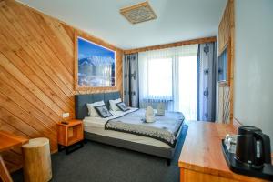 Posteľ alebo postele v izbe v ubytovaní My Tatra Residence