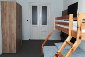 a bedroom with a bunk bed and a door at Green Park Rooms Brno in Brno +45 photos