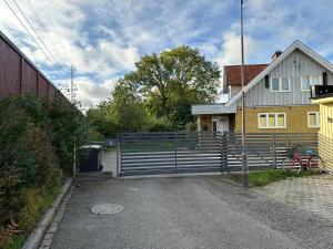 a house with a gate in front of a house at Vanni´s Bed & breakfast in Malmö