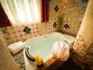 a bath tub in a bathroom with a tub at Black Forest Hotel Todtnau in Todtnau