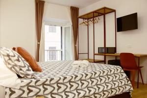 Postel nebo postele na pokoji v ubytování Hotel Ciao