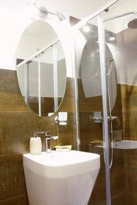 a bathroom with a sink and a mirror at Hotel Ciao in Rome