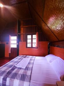Postel nebo postele na pokoji v ubytování Pai Kiniman Resort