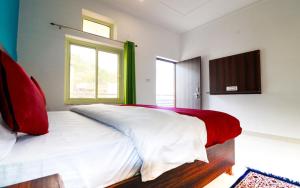 Postel nebo postele na pokoji v ubytování Manzil Hostel