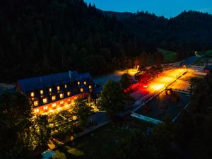 an overhead view of a building with lights at night at Chata Pieniny in Lesnica