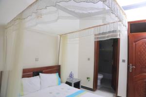 Ένα ή περισσότερα κρεβάτια σε δωμάτιο στο SAM Baraka Apartments