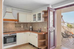 Kuchyň nebo kuchyňský kout v ubytování Villa Resperi