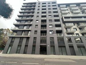 a tall apartment building with its doors open at Dagály Apartments by UrbanRent in Budapest