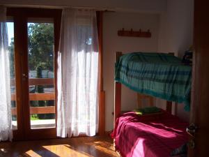 Ένα ή περισσότερα κρεβάτια σε δωμάτιο στο La Reserva Natural Chalet +24 φωτογραφίες