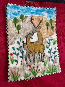 a painting of two deer in a forest at Handicraft house in Karakol